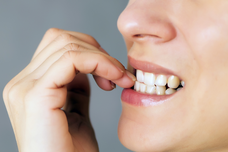 nail biting affects your teeth